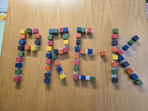Display of the word Pre-K spelled out with blocks