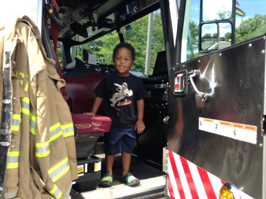 child in fire truck