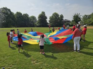Students engaged in parachute play.