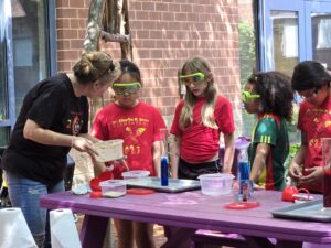 Students engaged in science experiment.
