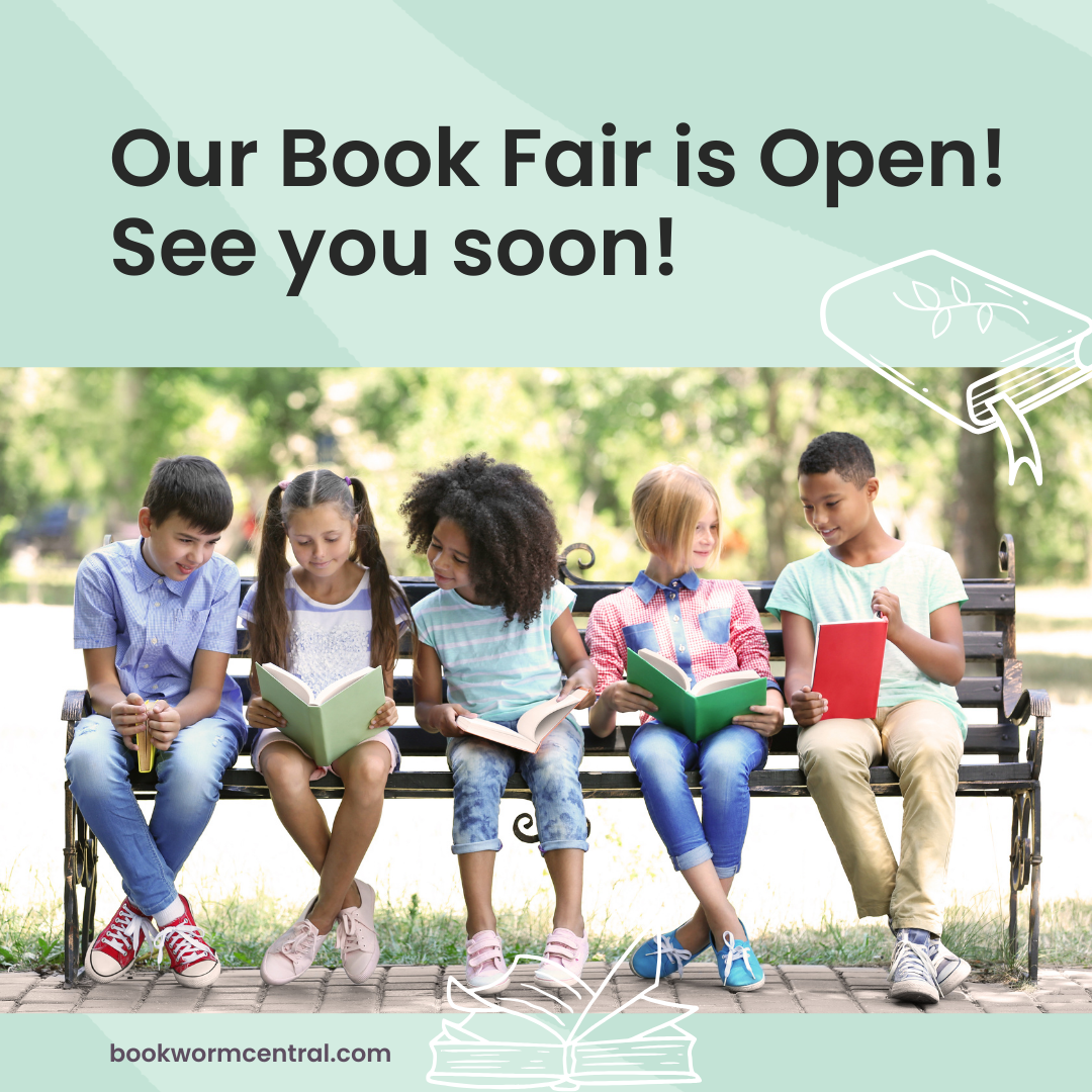 Picture of 5 children sitting on a bench outside reading books