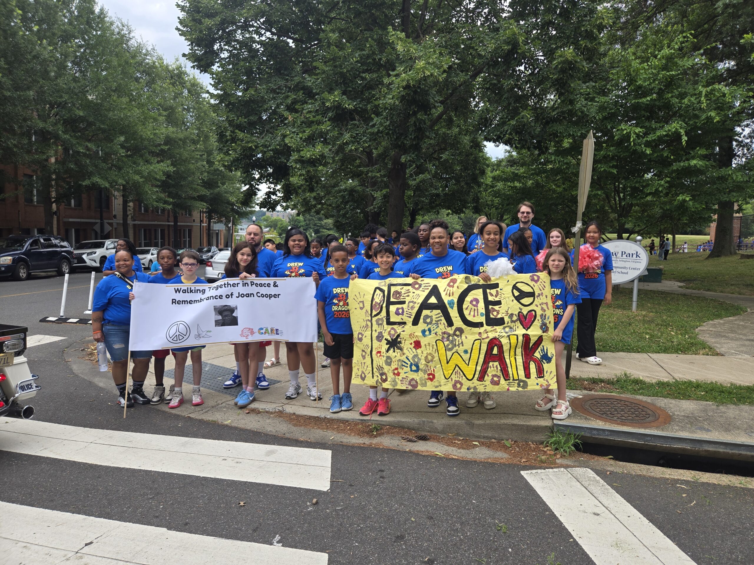 picture of students holding a banner for a peace walk